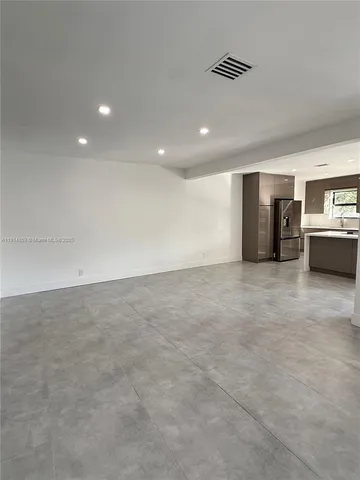 a sink with a cabinet and mirror