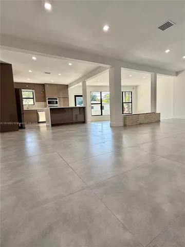 a kitchen with a stove and a microwave