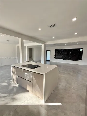 a bathroom with a double vanity sink toilet and shower