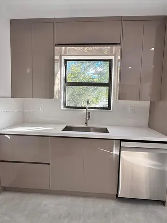 a sink with a cabinet and mirror