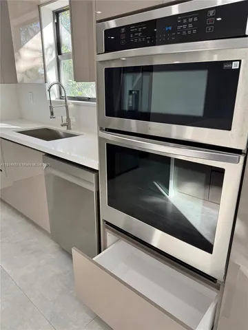 a view of a livingroom with a ceiling fan and window