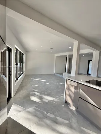 a view of a hallway with windows