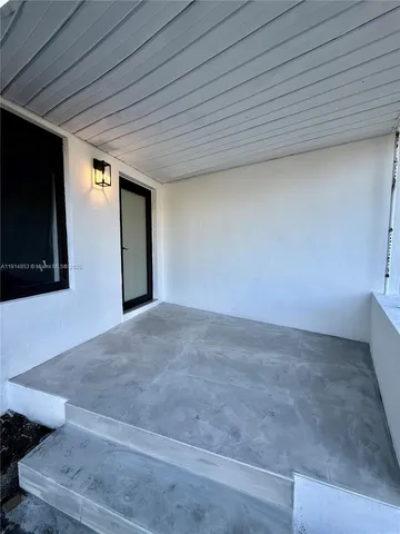 a kitchen with stainless steel appliances kitchen island granite countertop a sink and a stove