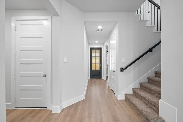 a view of entryway with wooden floor