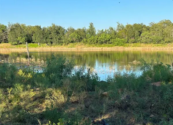 a view of a lake with houses in outdoor space