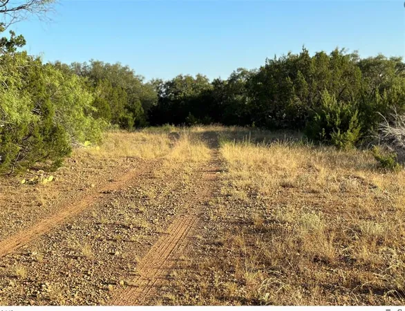 a view of lake with green space