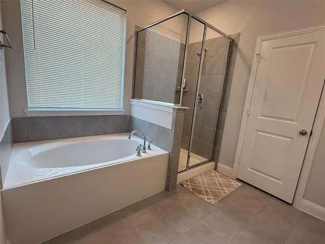 a bathroom with double sink and a mirror