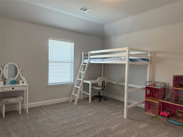 a view of a bedroom with a window