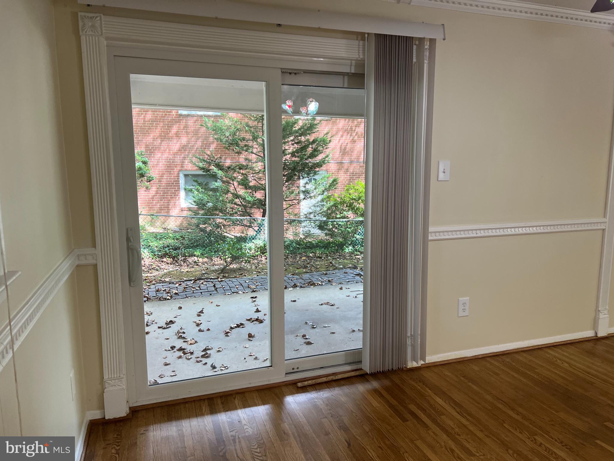 5626 Heming Avenue Springfield, VA 22151 - Photo 11 of 53 a view of a room with wooden floor and doors