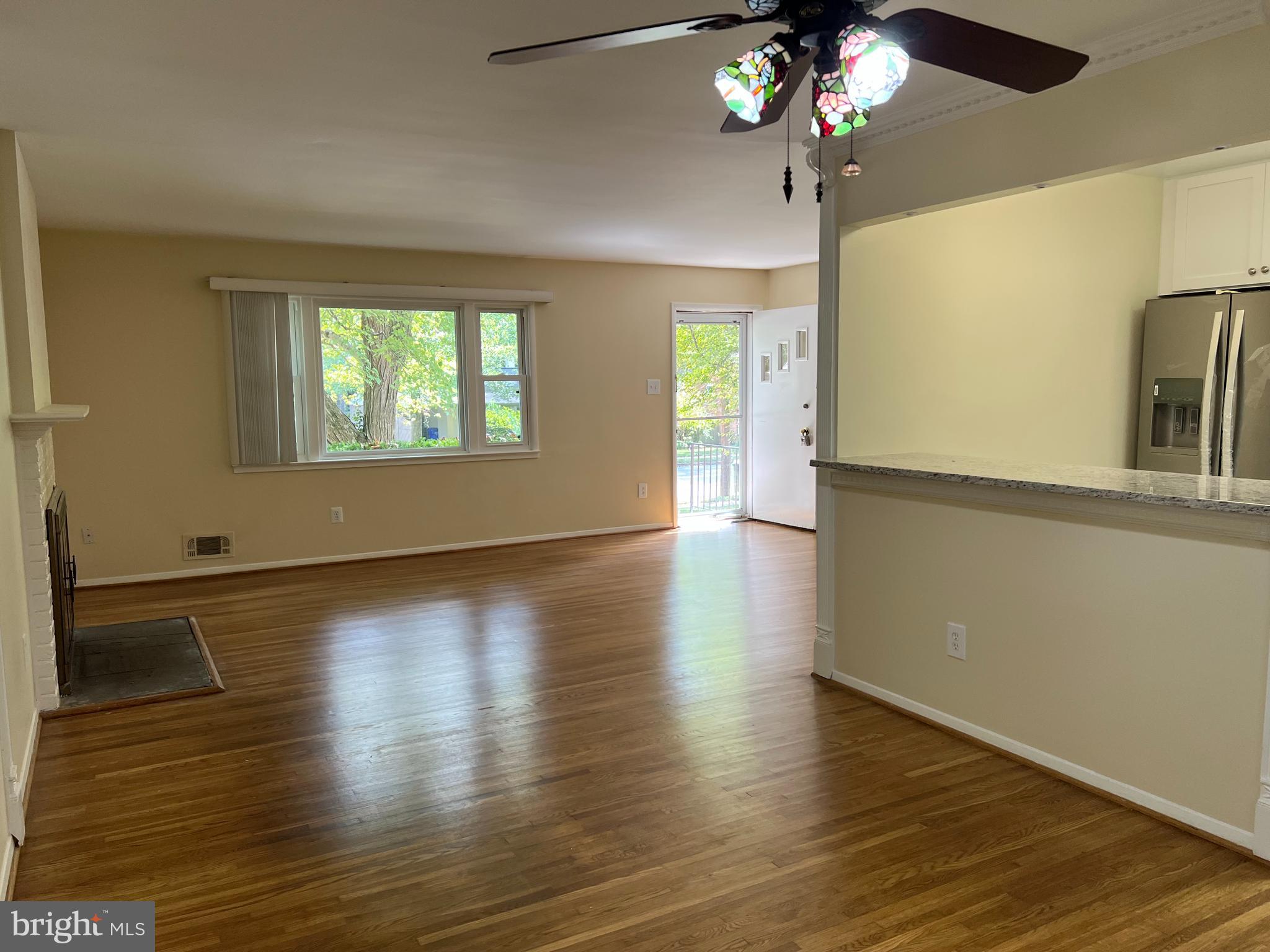 5626 Heming Avenue Springfield, VA 22151 - Photo 18 of 53 a view of an empty room with wooden floor and a window