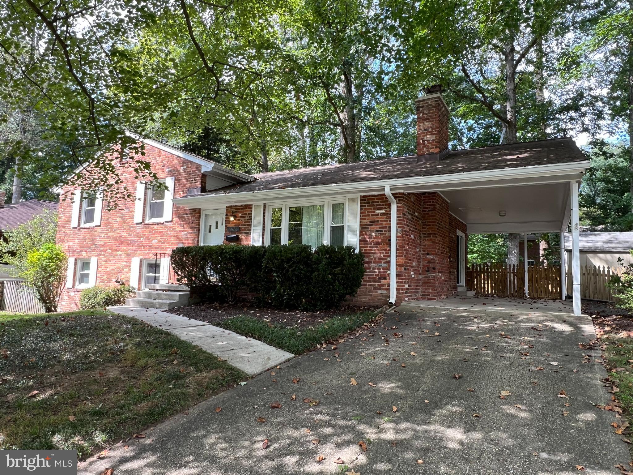 5626 Heming Avenue Springfield, VA 22151 - Photo 2 of 53 a front view of a house with a yard