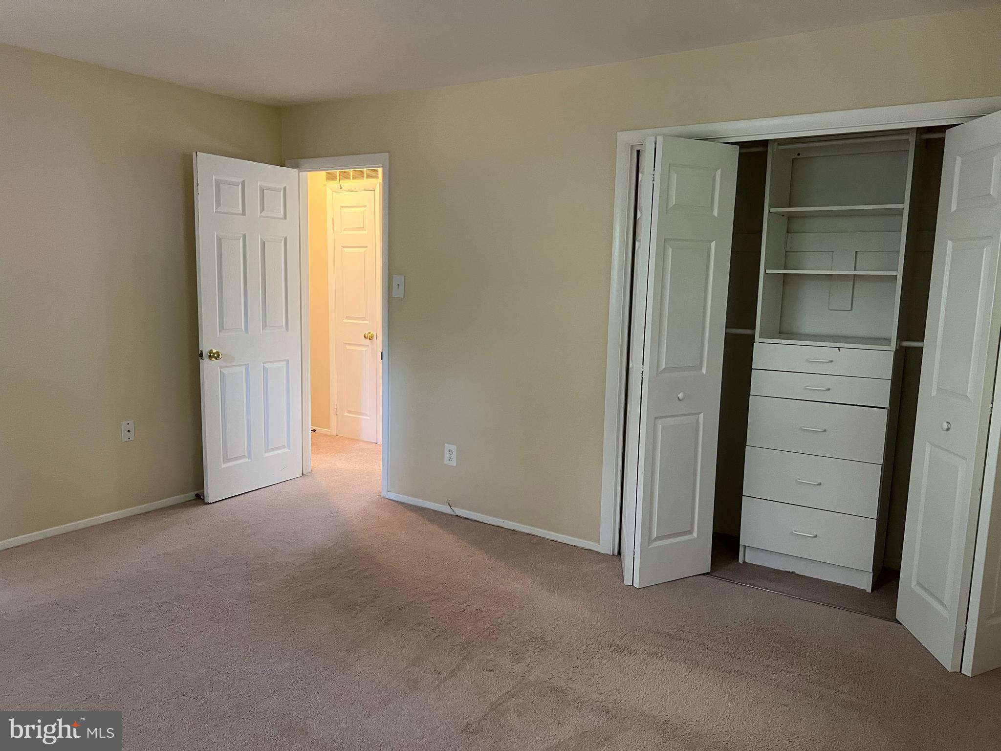 5626 Heming Avenue Springfield, VA 22151 - Photo 22 of 53 an empty room with closet and wooden door