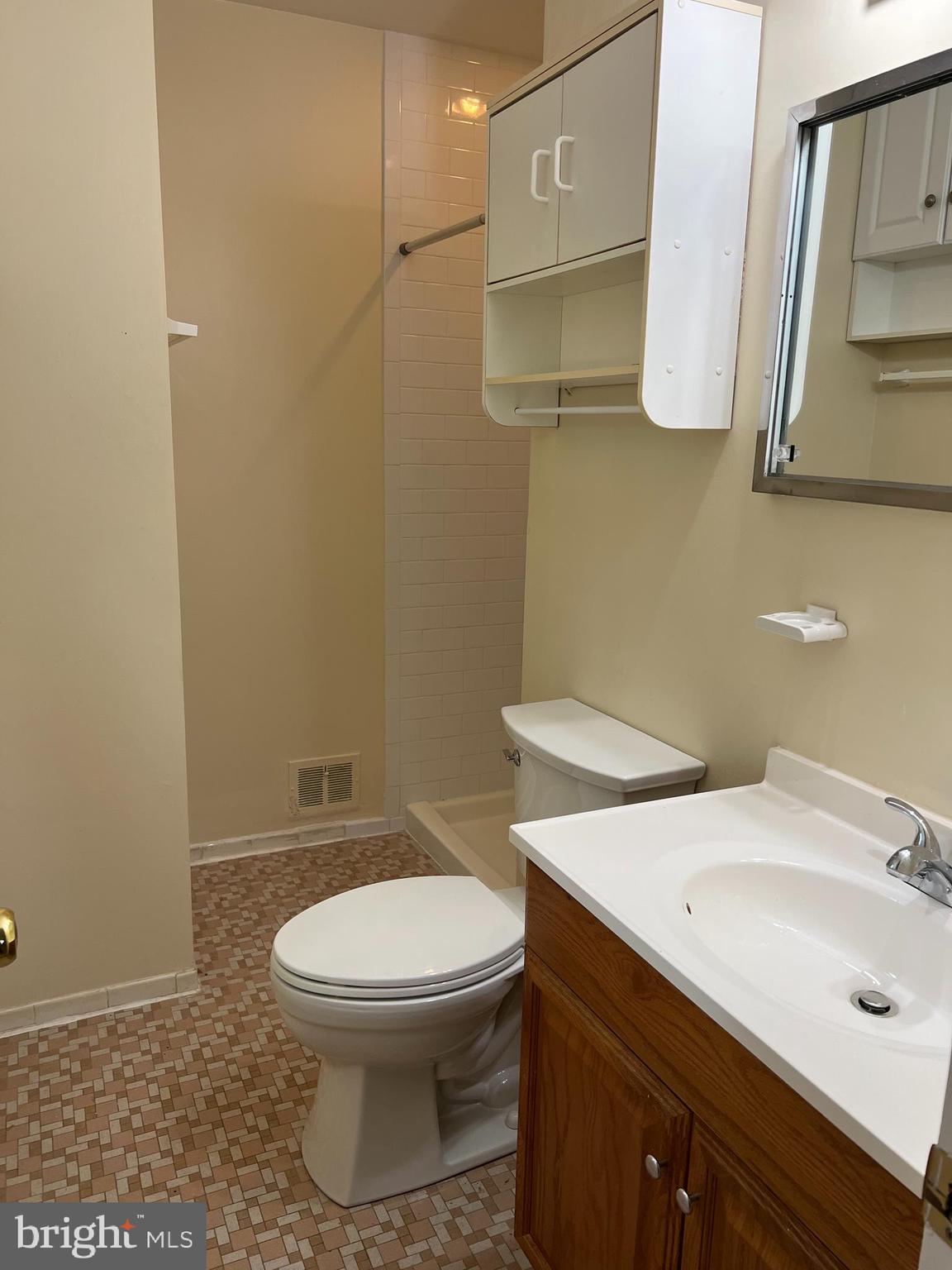 5626 Heming Avenue Springfield, VA 22151 - Photo 24 of 53 a bathroom with a toilet a sink and mirror