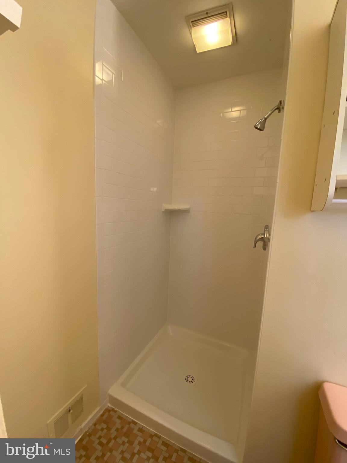 5626 Heming Avenue Springfield, VA 22151 - Photo 25 of 53 a bathroom with a shower