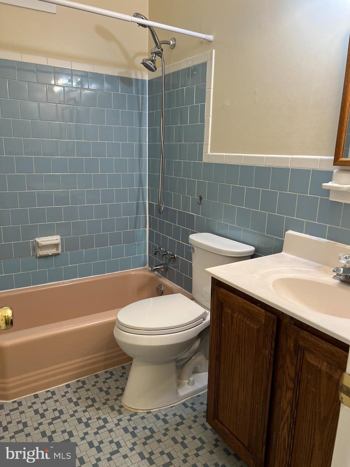 5626 Heming Avenue Springfield, VA 22151 - Photo 32 of 53 a bathroom with a sink a toilet and bathtub