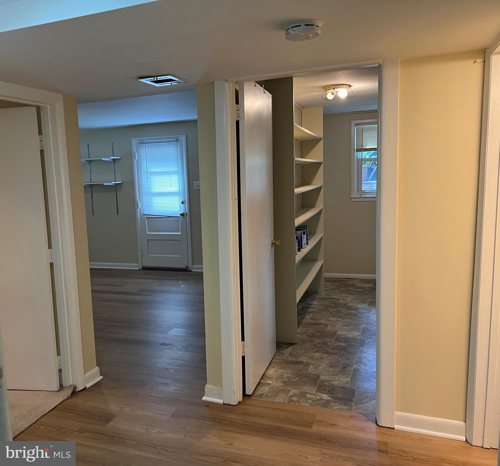 5626 Heming Avenue Springfield, VA 22151 - Photo 39 of 53 a view of a hallway with wooden floor