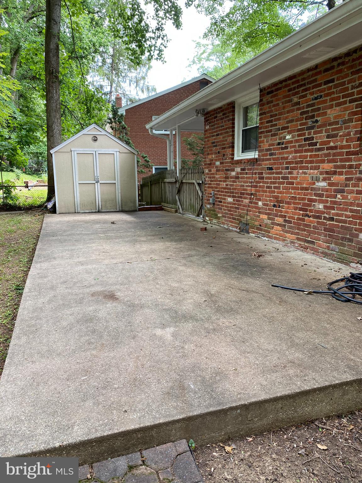 5626 Heming Avenue Springfield, VA 22151 - Photo 50 of 53 a backyard of a house with table and chairs