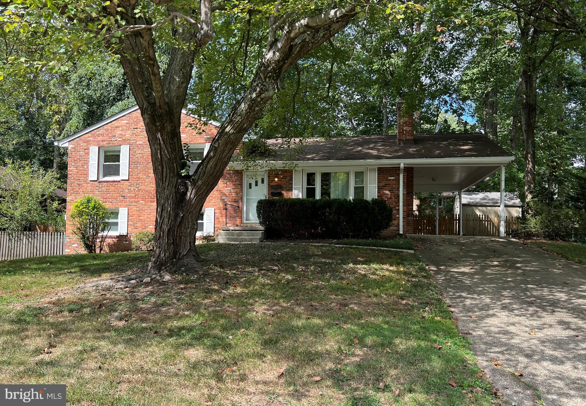 5626 Heming Avenue Springfield, VA 22151 - Photo 53 of 53 a front view of a house with a garden