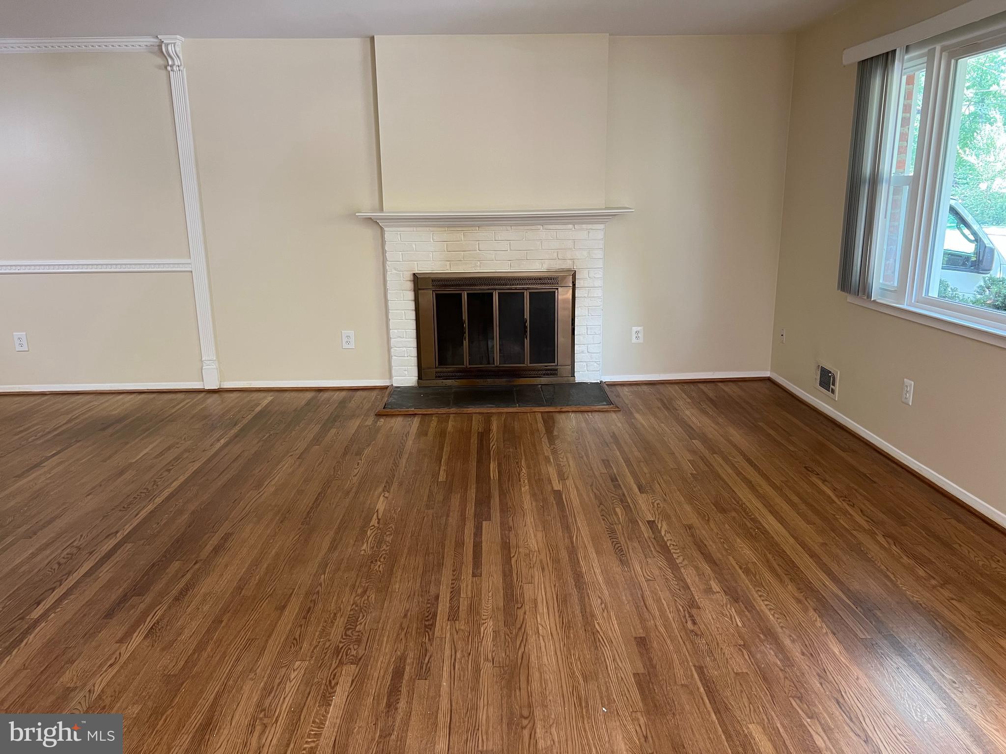 5626 Heming Avenue Springfield, VA 22151 - Photo 6 of 53 a view of an empty room with wooden floor and a window