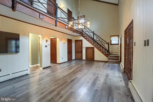 a kitchen with stainless steel appliances granite countertop wooden cabinets a sink and a stove