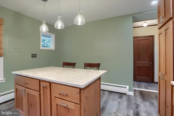 a bathroom with a sink and mirror with toilet