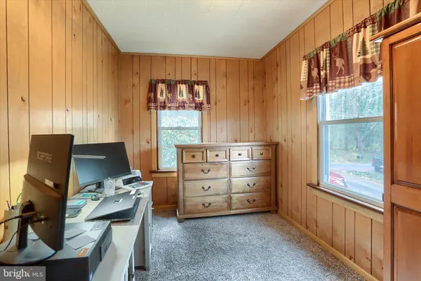 a view of a living room and wooden floor