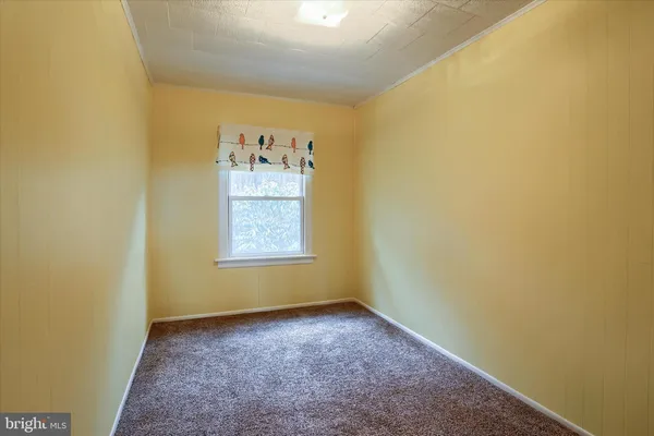 a view of a wooden door with a yard