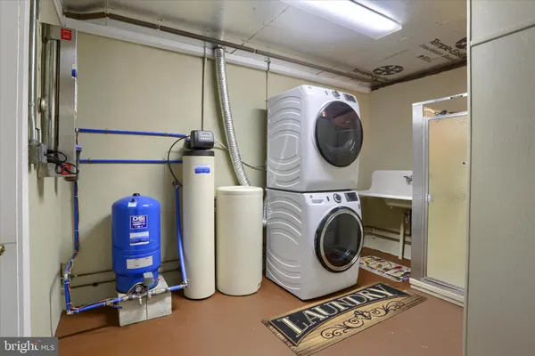an aerial view of ocean with residential house with outdoor space