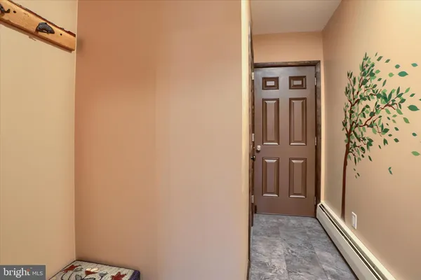 a living room with a fireplace and a wooden floor