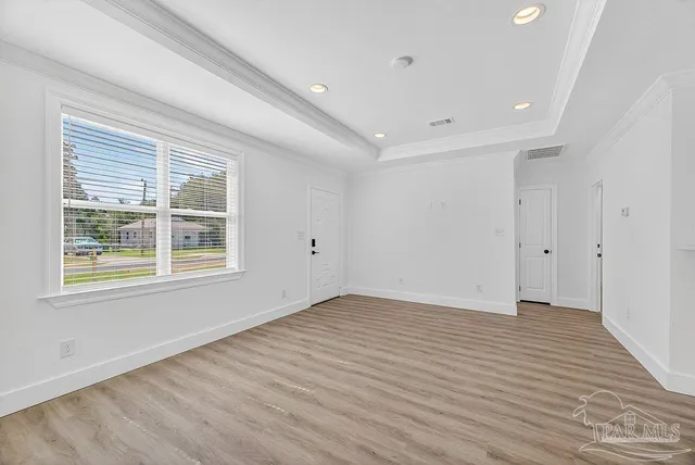 a bathroom with a toilet a sink a mirror and a shower