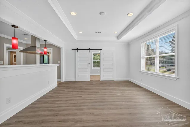 a kitchen that has a refrigerator and a sink