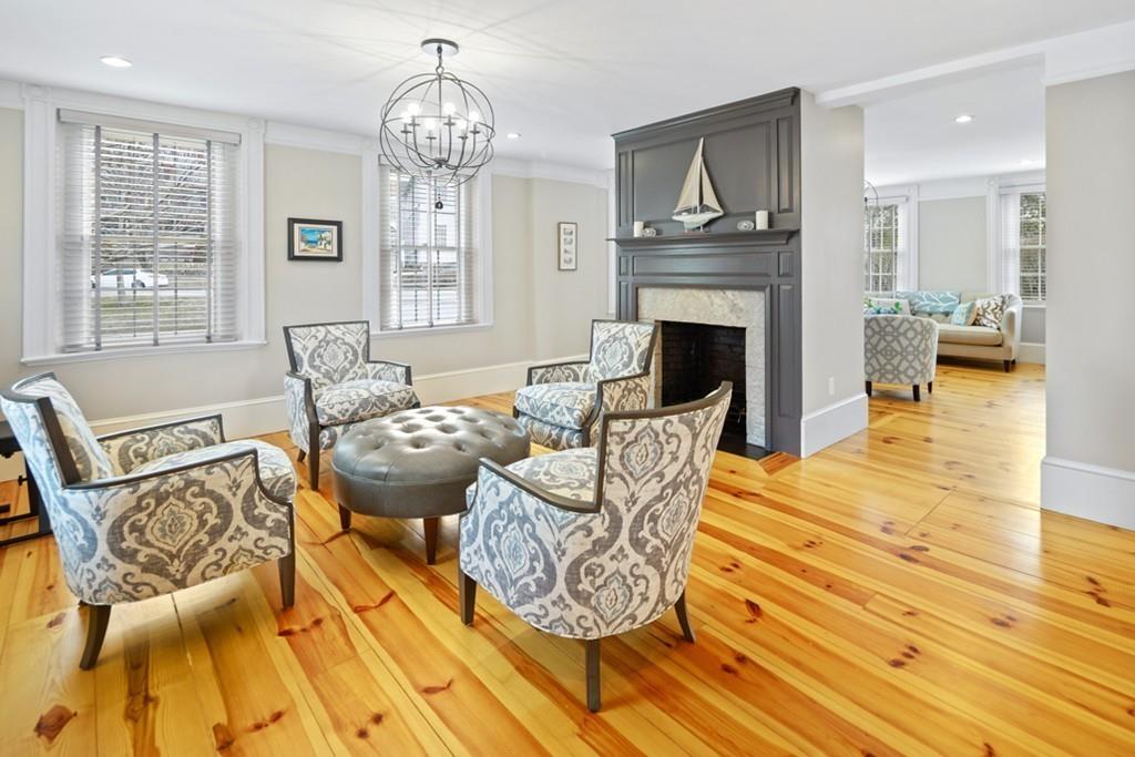 170 North Street Hingham, MA 02043 - Photo 13 of 42 a living room with furniture a fireplace and a chandelier