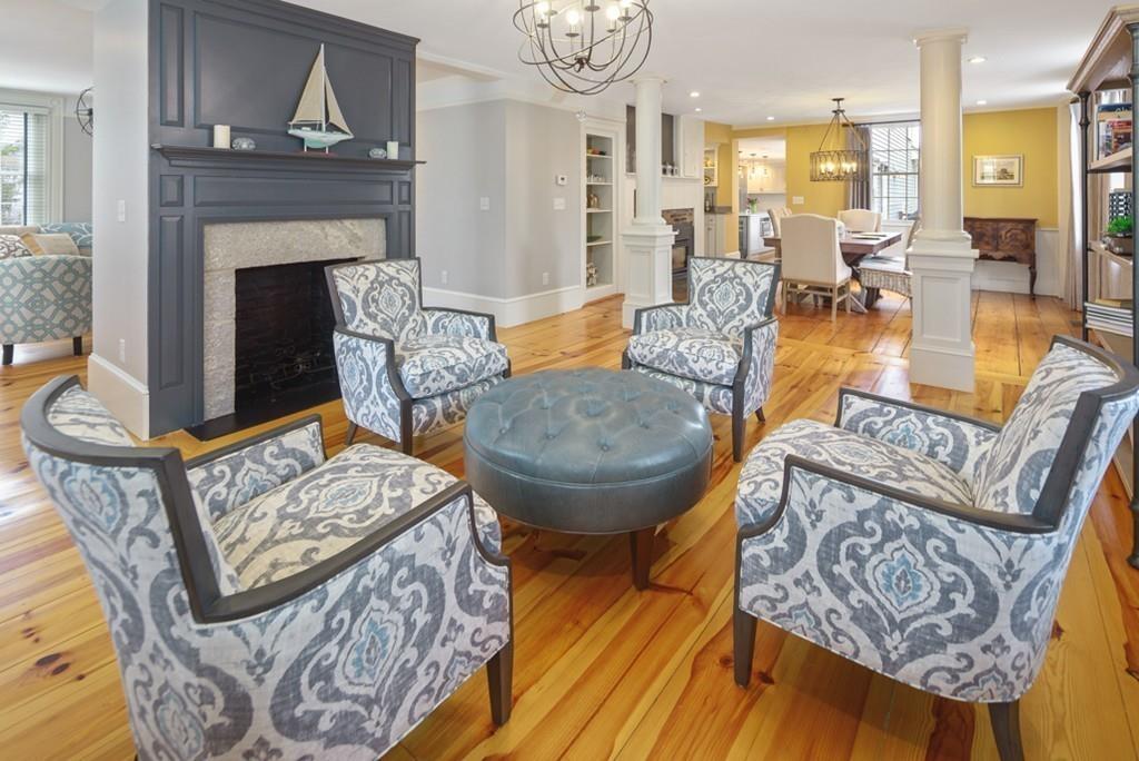 170 North Street Hingham, MA 02043 - Photo 14 of 42 a living room with furniture a fireplace and a chandelier