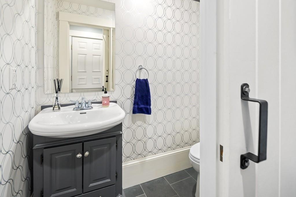 170 North Street Hingham, MA 02043 - Photo 18 of 42 a bathroom with a sink a toilet and shower