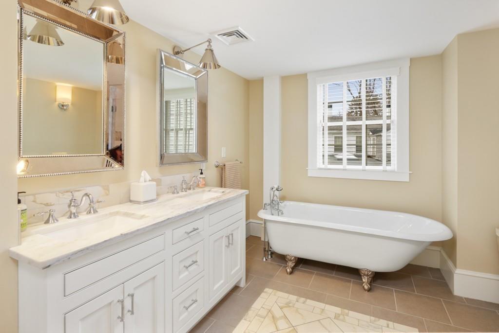 170 North Street Hingham, MA 02043 - Photo 22 of 42 a spacious bathroom with a double vanity sink a mirror and a bathtub