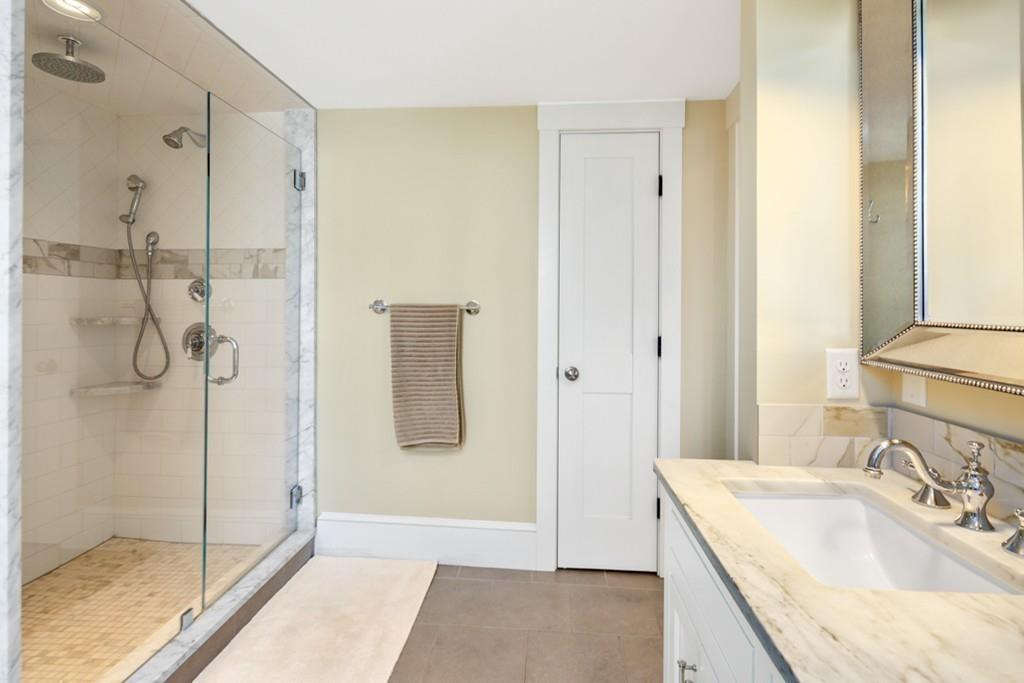 170 North Street Hingham, MA 02043 - Photo 23 of 42 a bathroom with a granite countertop sink a shower and
