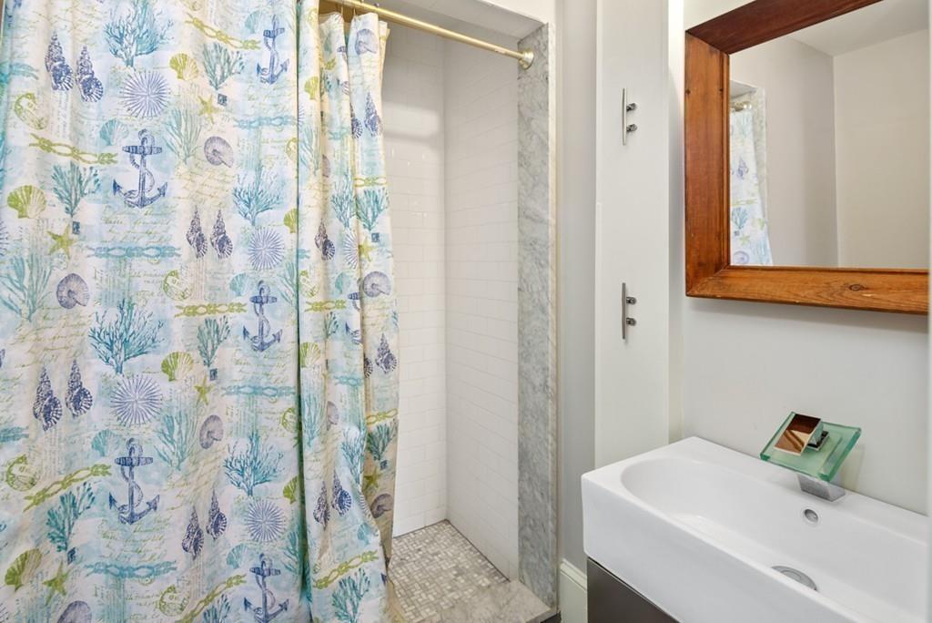 170 North Street Hingham, MA 02043 - Photo 26 of 42 a bathroom with a sink and vanity