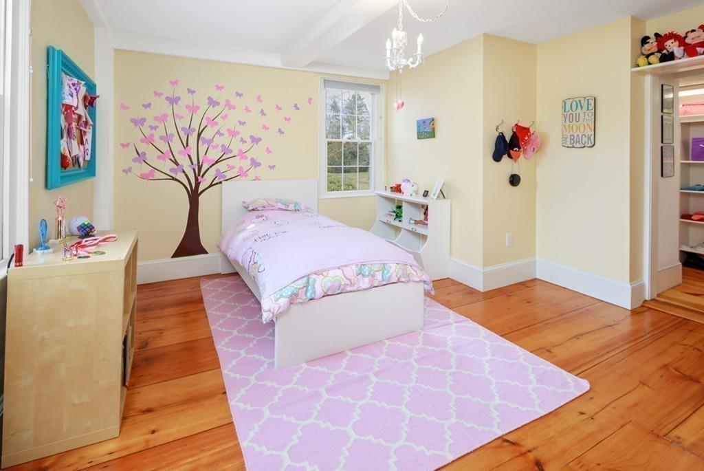 170 North Street Hingham, MA 02043 - Photo 27 of 42 a bedroom with a bed and a table with potted plant