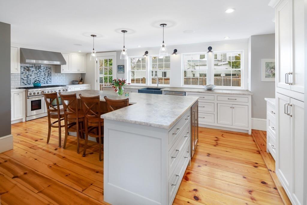 170 North Street Hingham, MA 02043 - Photo 3 of 42 a large kitchen with kitchen island a large counter space and stainless steel appliances