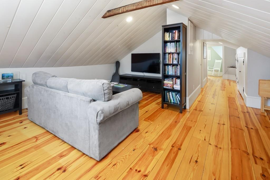 170 North Street Hingham, MA 02043 - Photo 32 of 42 a living room with furniture and a flat screen tv