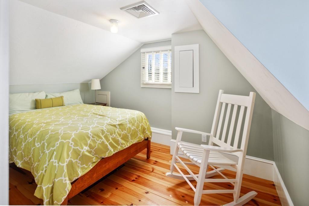 170 North Street Hingham, MA 02043 - Photo 34 of 42 a bedroom with a bed and wooden floor