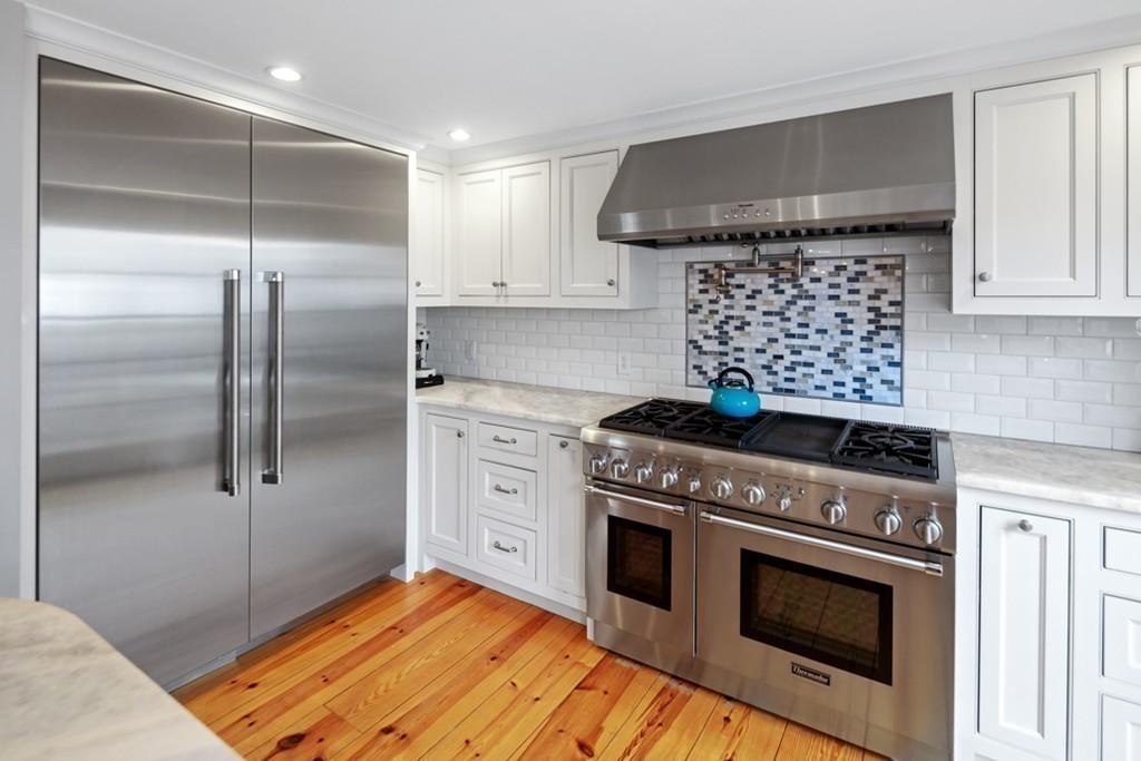 170 North Street Hingham, MA 02043 - Photo 5 of 42 a kitchen with a stove oven and sink