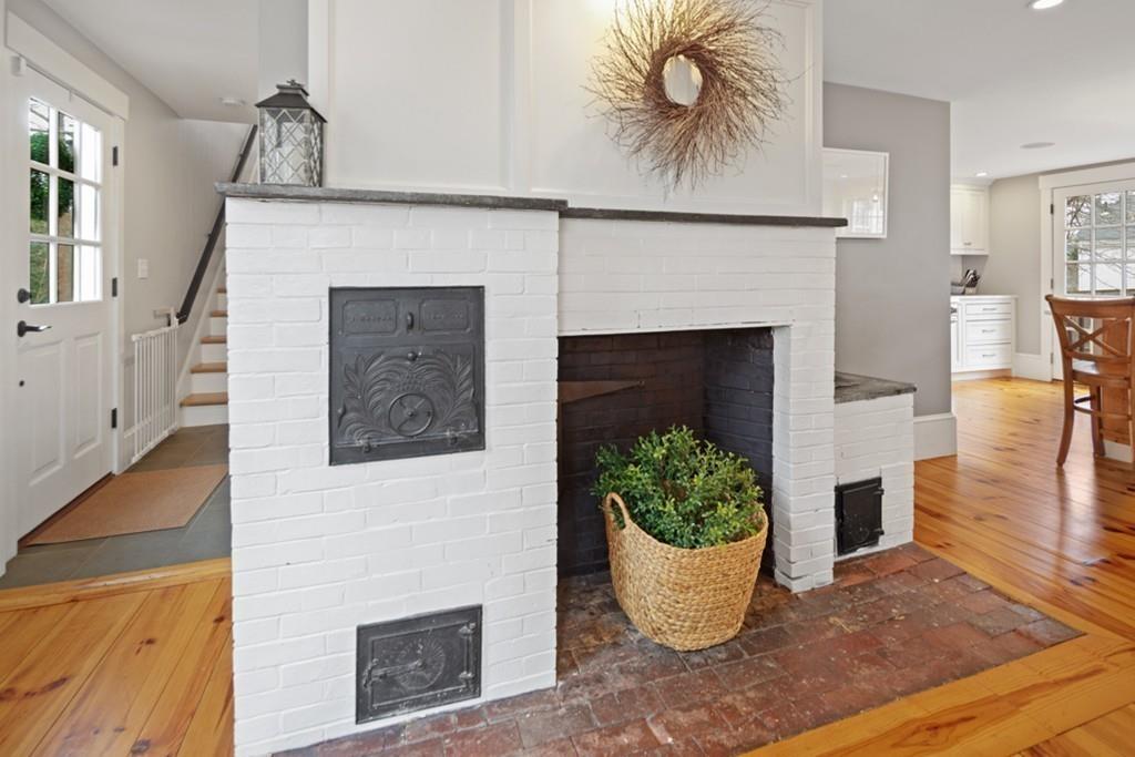 170 North Street Hingham, MA 02043 - Photo 8 of 42 a front view of a house with fireplace and wooden floor