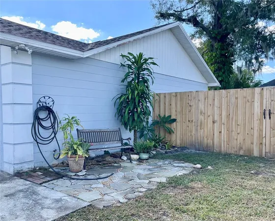 a couple of potted plants in front of door