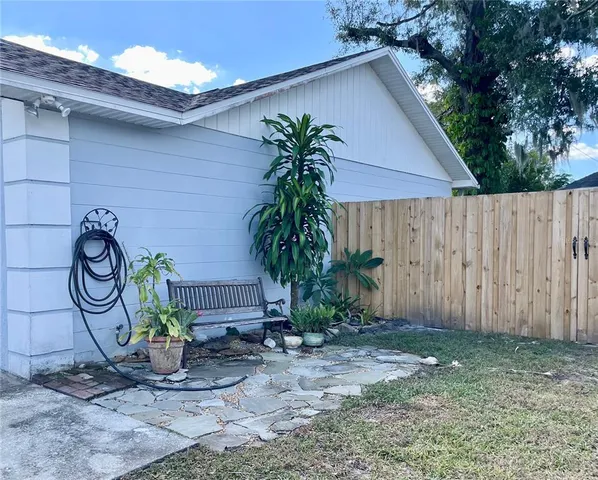 a couple of potted plants in front of door