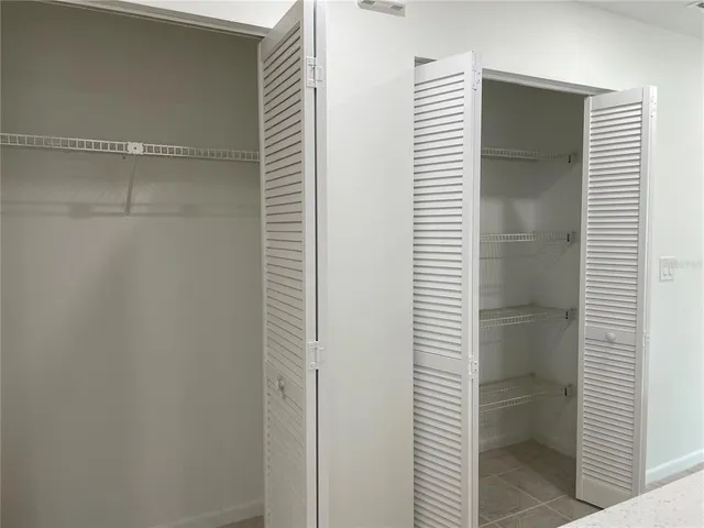 a bathroom view with a shower and a toilet