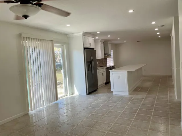 a kitchen with stainless steel appliances a refrigerator and a sink