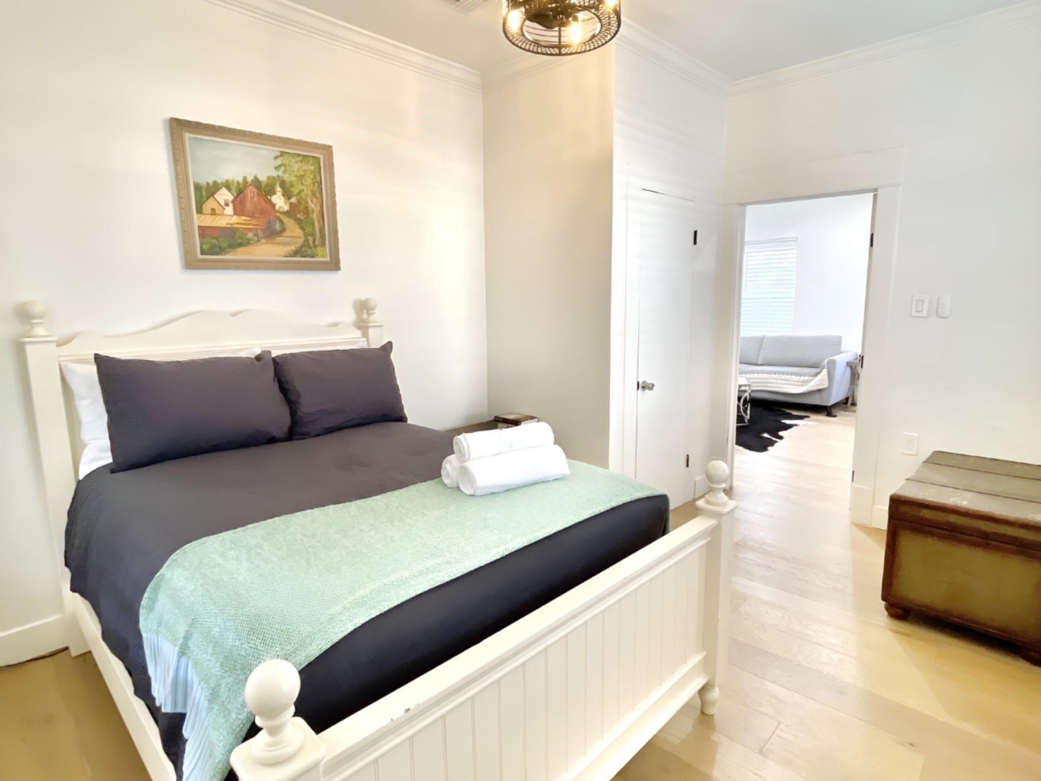 301 Tabor Street Houston, TX 77009 - Photo 10 of 14 a bedroom with a bed and a couch