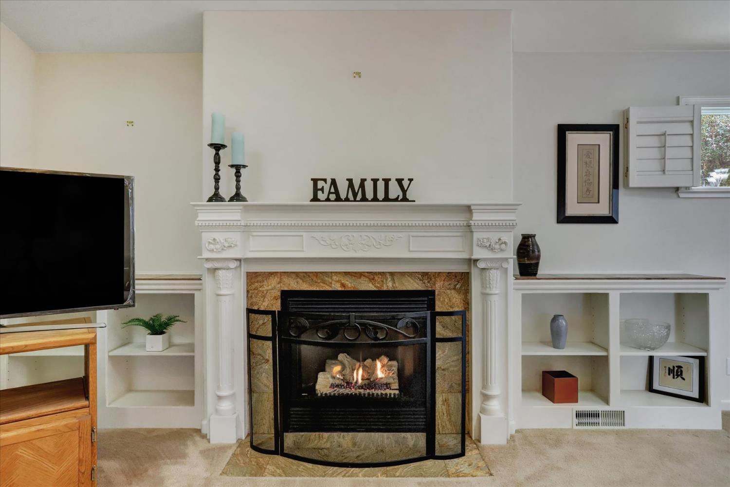124 Ruby Ledge Court Grass Valley, CA 95945 - Photo 12 of 87 a living room with furniture and a fireplace