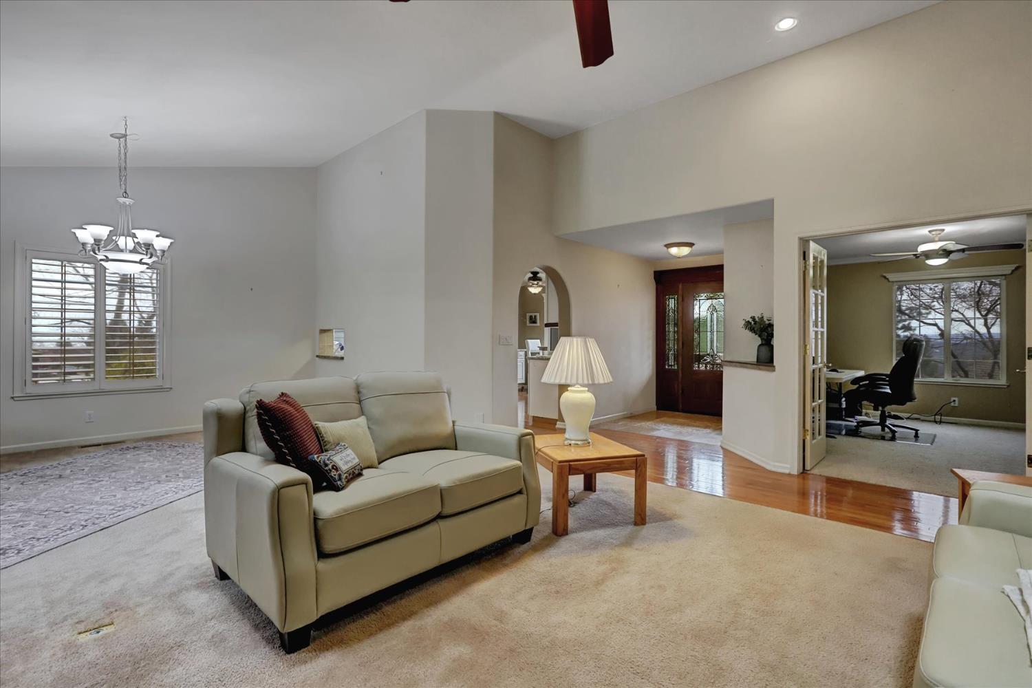 124 Ruby Ledge Court Grass Valley, CA 95945 - Photo 13 of 87 a living room with furniture and a chandelier